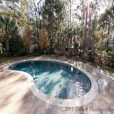 Travertine Pool Deck with custom design Oudoor Fireplace This pool deck and fireplace was a custom design for our client in Charleston, South Carolina.
