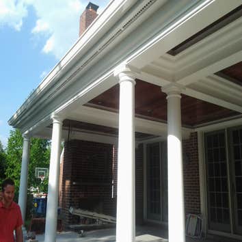 Ext trim and siding Custom corner columns with azek soffit trim and enhancing crown molding with hardboard clapboard siding 7" exposed