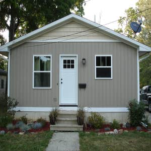 M Fox Builders (Home Remodel) Newly upgraded exterior w/ board and batten vinyl siding and shakes, and kitchen renovation.
