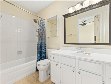 Photos by Sunlara #1 Home renovation including bathroom tub, tile surround, paint, baseboard replacement, flooring replacement, custom cabinetry, and s
