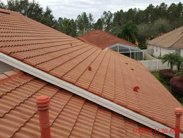 Photos from Popa Construction LLC Before & Afters of a soft wash roof cleaning and driveway and side walk cleaning.