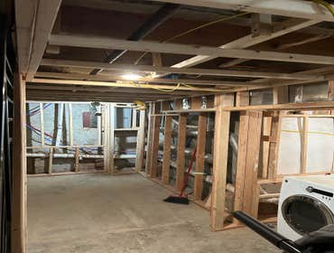 Photos by Your Expendable Services LLC #1 Basement remodeling project completed with new framework, walls placed and painted. New recess lights and LPV
