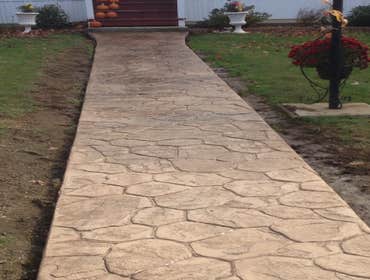 Photo(s) from O Brien Concrete Forms Random stone concrete walkway