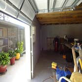 sales@bdi-homes.com We removed a Metal building from existing slab and constructed a 600sf block garage with a conventionally framed roof, Manual garag