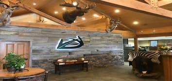 Commercial Entryway & Lobby Upfit Entryway columns and yard signage were custom built and installed. The stonework, wood structure, and metalwork are 