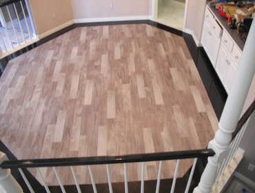 Photos by Floored #1 8 inch Galaxy Granite border.4 ix 24 inch Porcelian plank tile inlay.