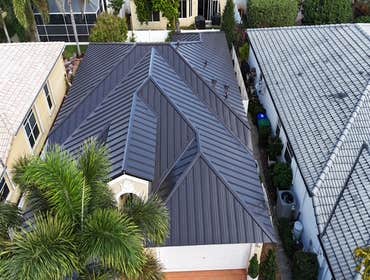 Photos by Gold Star Miami Corp #1 metal roof panels all are . 25 years warrantee