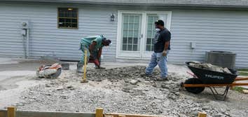 Photos by From the Ground Up #2 Removed deck and brick pavers and installed a concrete patio slab with a fir pit.