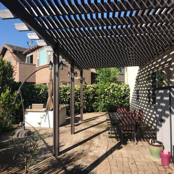 Hardscape, Patio Covers and Landscape Backyard Dreamscape including Lattice and Solid Ultra White with Exterior Lighting. Hybrid Grass, Drought Resista