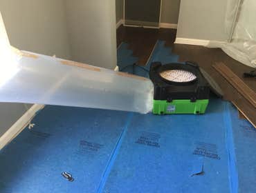 Mold Removal Washer had been leaking without homeowners knowledge until they noticed the floors warping.