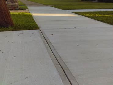 50' Sidewalk 26' Walk way to house and 10' Driveway apron 1 Month after pour
