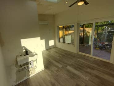 Photos by Stewart & Son Gate & Fence LLC #1 Tiny House with pergola. Small house 17' by 12' small bathroom with pocket door, and small sink with water 