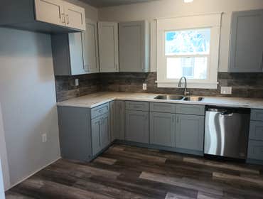 Photos by Dreamers Unlimited LLC #6 Complete kitchen remodel and cabinets flooring paint texture making cement countertops and installing appliances