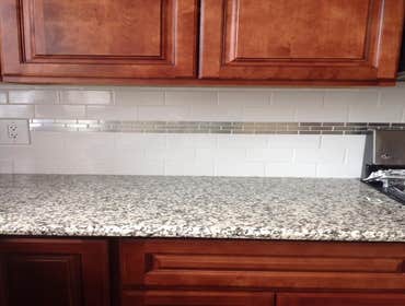Installation of Cabinets, countertop, backsplash and appliances