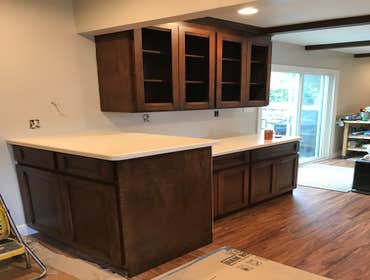 Earth Tone Haven Custom Kitchen Cabinets, Laminate floors throughout, full electrical panel upgrade and all new LED recessed lights.