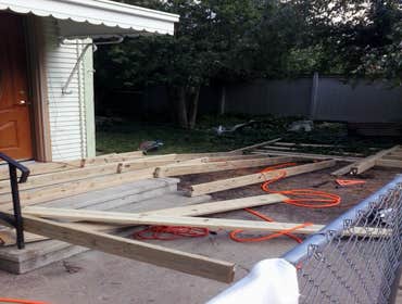 Project photos from Quality Vision Construction Building a custom wheelchair ramp with deck area.