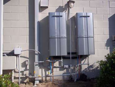 Plumbing and Tankless Water Heater Systems We replaced a standard hot water tank at a local restaurant with a new tank less water heater. As you can 