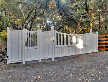 Custom Gate Installation in Lafayette, CA We recently completed a beautiful steel and wood dual-swinging driveway gate with an integrated pedestrian ga