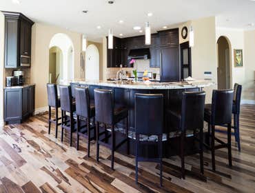 Refined Sycamore Kitchen This striking remodel involved relocating a laundry room and changing the layout to create a great room that truly brings the 