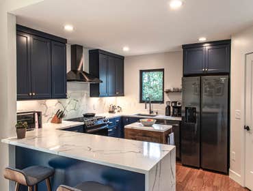Modern Kitchen Renovation This existing kitchen was in need of a substantial face lift, from the small upper cabinets and dated appliances, to the chea
