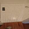 Larry Mosley custom tile installation logo