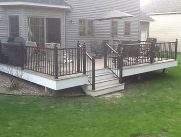 Photos by Custom Home Specialties Inc #2 Timber Tech maintenance free decks with powder coated railings.