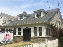 Covered back deck and side porch This beautiful backyard oasis includes a spacious deck which is partially covered by a 12 foot cathedral roof. This 