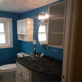 New remodeled bathroom New amenities with light fixtures and granite counter sink. Total bathroom remodeling.