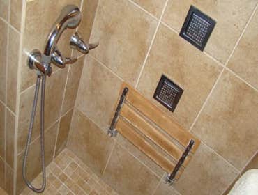 Disability Access Bath Remodel We completely remodeled this residential bath to make it ADA compliant. Notable features include a tiled ramp for ease 