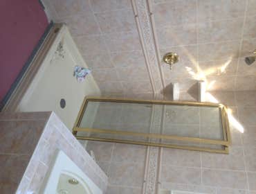 Photos by JAS Remodeling Inc #2 R&R shower pan. Replace plywood sub flooring under pan. Re-tile shower. Install new frameless shower, tub and shower fa