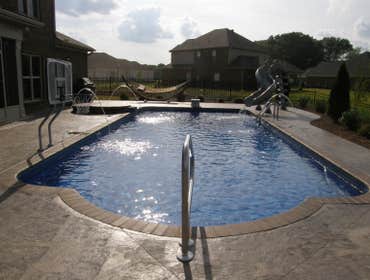 Clearwater Pools 16x36 w/custom steps 16x36 w/custom steps, brick coping,spillover spa, basketball, deck jets and Xtreme slide. South Huntsville.