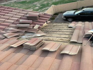Photos by Jilek Roofing #1 Removed tiles above roof leak area. Replace roof tile underlayment and replace roof tile.
