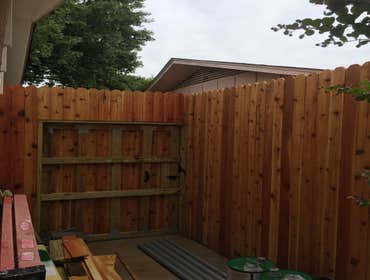 8' Cedar Fence with 10' steel poles