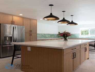 Farmhouse charm meets modern design Warm wood tones, elegant quartz countertops, bold black fixtures, and a refreshing green tile backsplash come toget