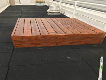 Work photos Remove old stain from wood benches and apply new stain and repaint of all stucco walls, metal base, upper trim base, doors, handrails, and 