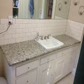 Complete Bathroom Remodel Tiled floors, tiled walls, Custom made vanity, Replace counter top with granite, Tiled bath area, and painted walls