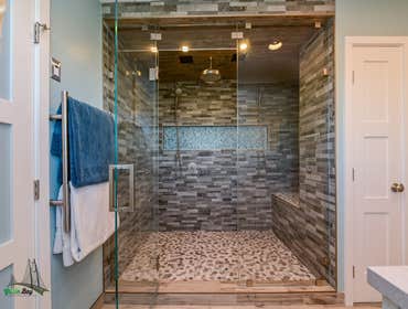 Bathroom Remodel Freshly remodeled bathroom with a lavishly designed and open shower plan You can get lost in there! The wood flooring and sink design 