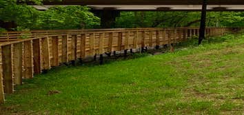 Photo(s) from RamJack Mississippi LLC Boardwalk helical piles with battered piles. Bridge abutment piles
