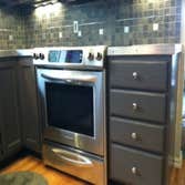 Lake Stevens Kitchen Remodel We installed a porcelain tile counter top and backsplash accented with aluminum strips and squares. Aluminum flat bar was