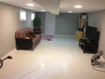 Basement Renovation Removed 50yrs old wood panel and installed drywalls and new lighting system and installed tiles on the floor.