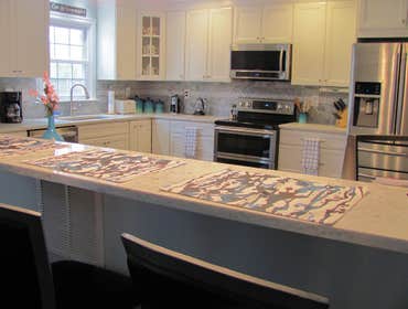 Kabacoff We completely remodeled the kitchen with Aristokraft cabinetry in a white paitned finish and Quartz LG Rocco countertop
We installed new hard