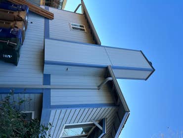 Ground View of the chimney with new LP T1-11 panels and LP trim