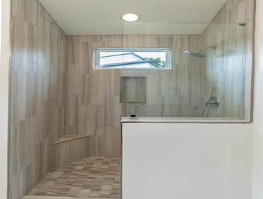 Bathroom remodel at Carolina Oaks These two bathrooms were finished in just 6 days. These tiles were specific chosen by our crew to help design the bat