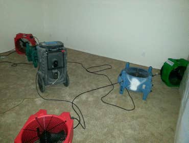 Project photos from Paradigm Flood & Restoration, Inc. Water damage dry down
