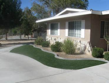 Artificial Turf Installation Before and after pictures for a synthetic turf system.