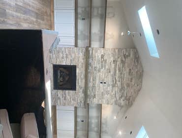 Photos by Stormbringer Construction #5 Custom built - in shelving unit and fireplace