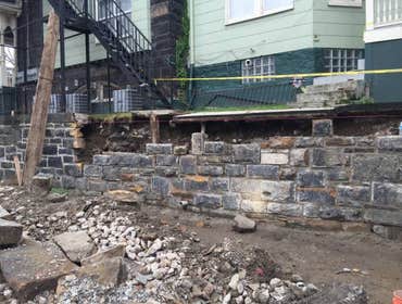 Photos from Hollis Contracting With the old stone wall, we tore down carefully to reuse he store. with the wall down we dug back the dirt, placing a fr