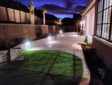 Photos by A Y & Sons Landscape & Design #2 New paver driveway, putting green, lighting and seat walls