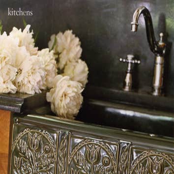 Flirting with formality A ceramic farmhouse sink and vintage-style faucet suit the formal character of a 1890s home. A floral motif on the sink apron a