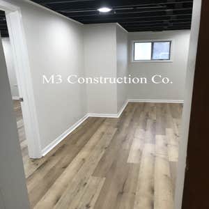 Photos by M3 Construction Co #3 Tear out drop cieling. Spray cieling black, frame in new wall with close and bedroom door. Paint walls, new door...
